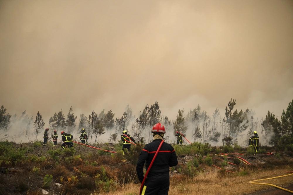 Fire Fighters push back wild fire near Lege-Cap-Ferret in southwestern France