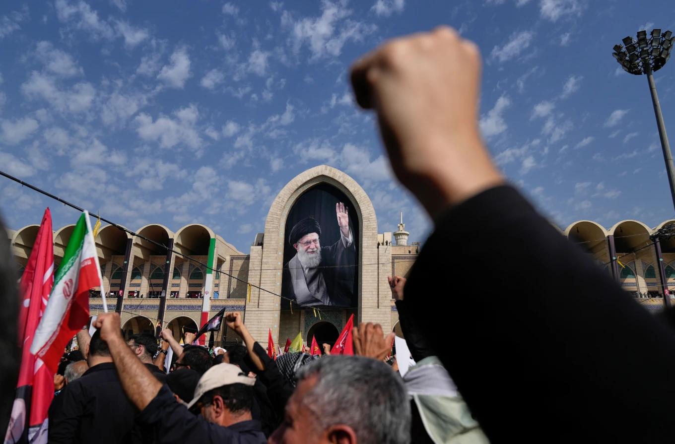 Mourners participate in funeral ceremonies.